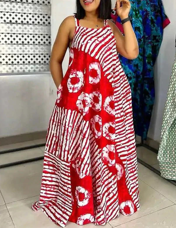 Abito lungo estivo da donna in tessuto batik rosso e bianco, design a righe e cerchi, senza maniche, ideale per moda casual e vacanze.