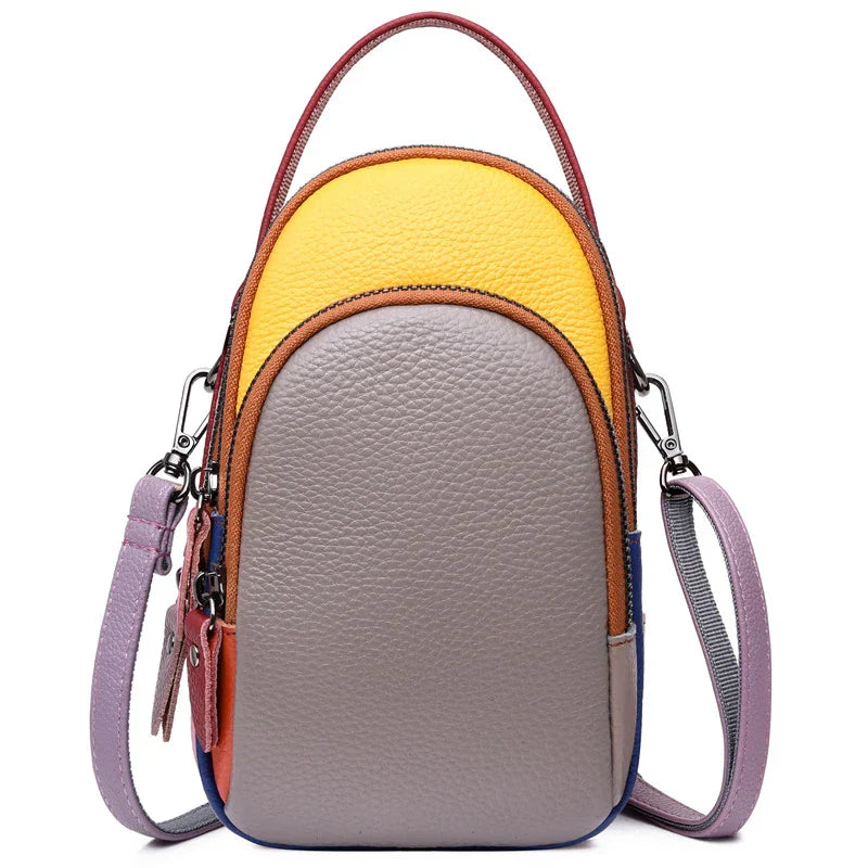 Borsa a tracolla multicolore in pelle, design moderno, con manico superiore e tracolla regolabile. Accessorio moda donna elegante e versatile.