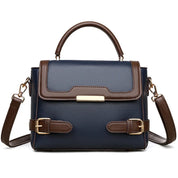 Borsa a tracolla donna in pelle blu e marrone, design elegante con fibbie decorative, manico superiore e tracolla regolabile. Accessorio moda chic.