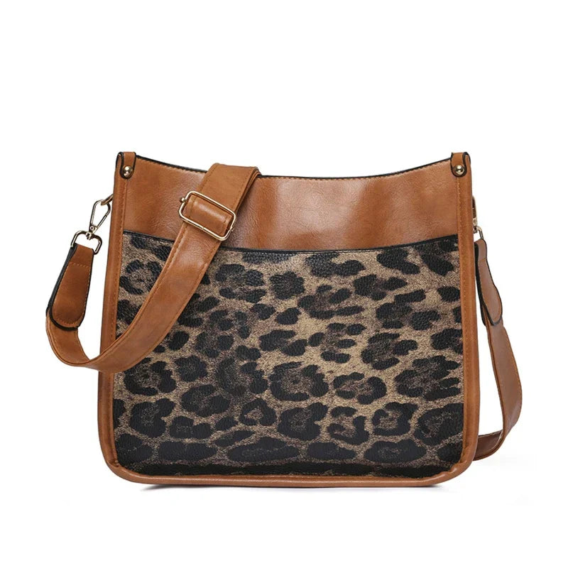 Borsa a tracolla in pelle marrone con stampa leopardata, design elegante e moderno, ideale per moda donna, accessorio versatile e di tendenza.