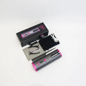 Arricciacapelli automatico senza fili grigio e rosa con accessori: cavo USB, pinza, pettine, manuale e custodia nera. Confezione inclusa.