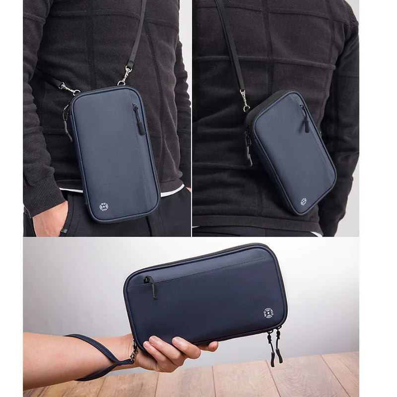 Borsa a tracolla uomo in pelle nera, design elegante e moderno, con cerniera e logo. Accessorio moda versatile per ogni occasione.