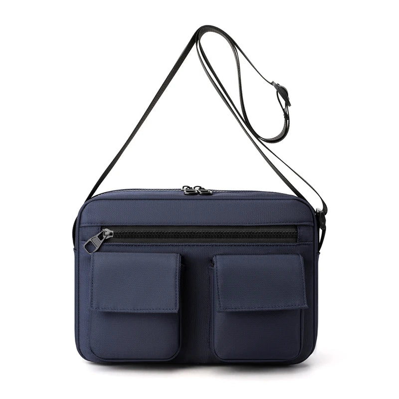 Borsa a tracolla blu scuro con doppia tasca frontale e cerniera, design elegante e funzionale, ideale per uomo e donna.