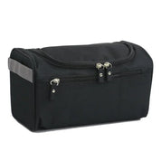 Borsa da toilette nera con doppia cerniera, manico laterale grigio, ideale per viaggi. Design compatto e resistente, perfetta per organizzare accessori.