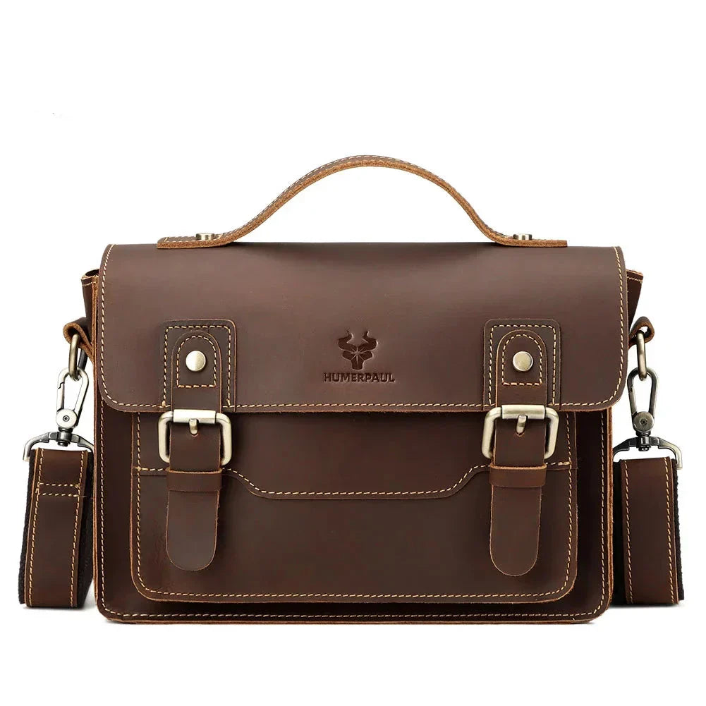 Borsa a tracolla in pelle marrone, design vintage, con fibbie e manico superiore. Ideale per lavoro e uso quotidiano. Elegante e resistente.