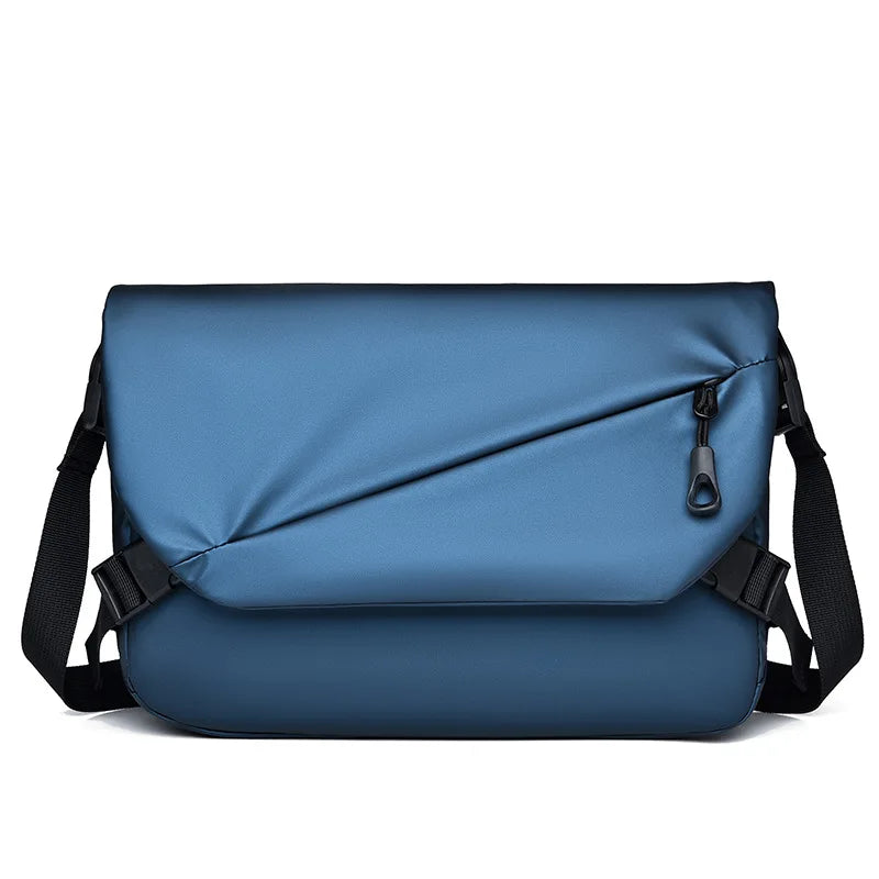 Borsa a tracolla blu elegante con design moderno, chiusura a zip, ideale per lavoro e viaggio. Accessorio moda unisex, resistente e spazioso.