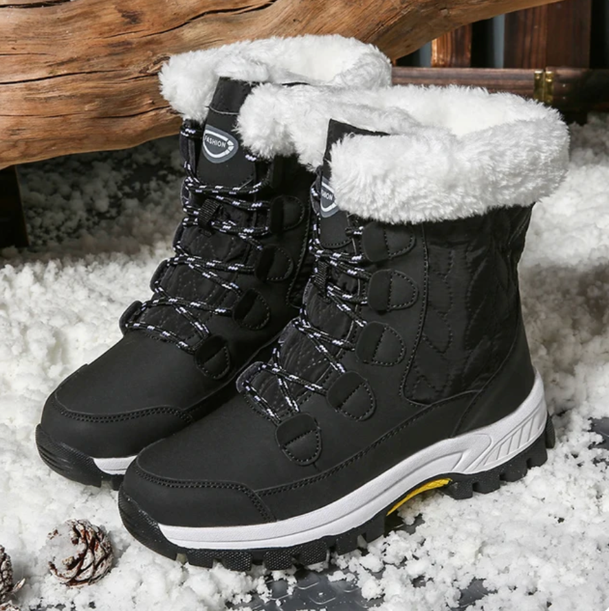 Stivali invernali neri da donna con fodera in pelliccia bianca, suola antiscivolo, ideali per neve e freddo. Design robusto e confortevole.
