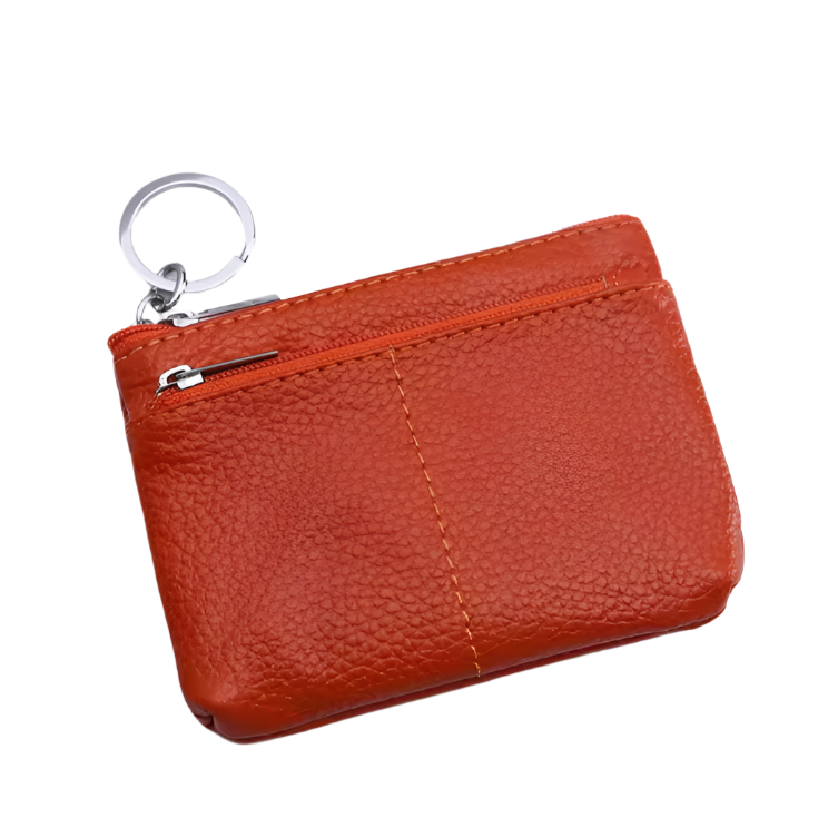 Portachiavi in pelle arancione con cerniera, design compatto, ideale per monete e chiavi. Accessorio elegante e pratico per l'uso quotidiano.