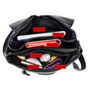 Borsa a tracolla nera in pelle con tasche multiple: tasca con zip, tasca principale, tasca laterale, spazio per telefono e accessori.