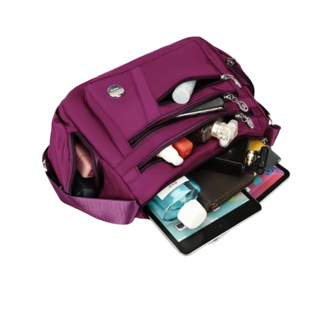 Borsa a tracolla viola con tasche multiple, contenente tablet, portafoglio, cosmetici e accessori. Ideale per viaggi e uso quotidiano.