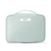 Astuccio trucco verde menta con manico, design compatto e etichetta "Makeup Beauty". Ideale per organizzare cosmetici e accessori viaggio.