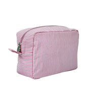 Astuccio da viaggio a righe rosa e bianche, chiusura con cerniera, tessuto resistente, ideale per cosmetici e accessori.