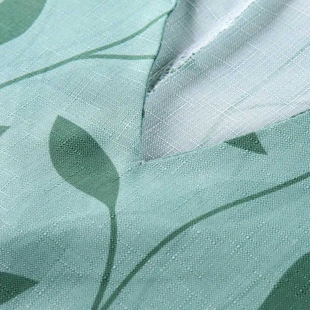 Tessuto verde con motivo foglie, trama intrecciata, ideale per abbigliamento e arredamento. Design naturale, tessuto di qualità, stile moderno.