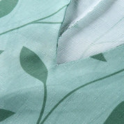 Tessuto verde con motivo foglie, trama intrecciata, ideale per abbigliamento e arredamento. Design naturale, tessuto di qualità, stile moderno.