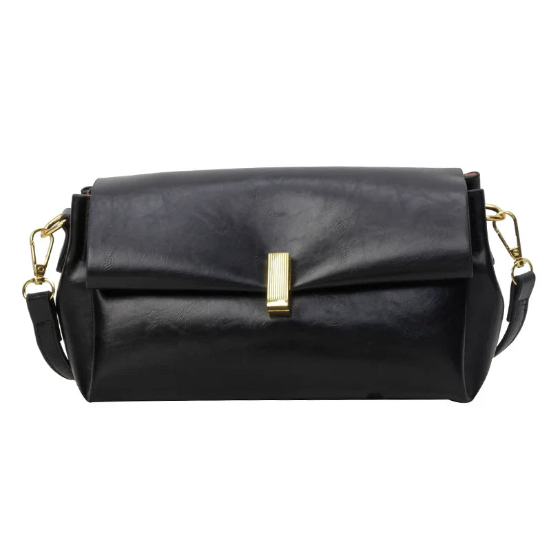 Borsa a tracolla in pelle nera con chiusura dorata, design elegante e moderno, accessorio moda donna, ideale per ogni occasione.