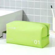 Astuccio da viaggio verde lime con cerniera, design moderno, manico laterale grigio, ideale per articoli da toeletta. Dimensioni: 23x11x15 cm.