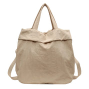 Borsa shopper in tela beige, design minimalista, manici doppi, ideale per shopping e uso quotidiano. Accessorio moda eco-friendly.