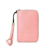 Portafoglio donna rosa in pelle con cerniera e cinturino, design elegante, ideale per viaggi e uso quotidiano. Accessorio moda femminile.