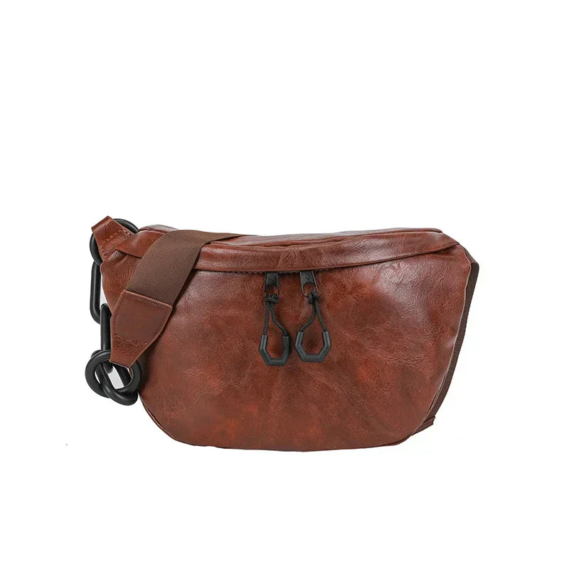 Marsupio in pelle marrone vintage, design elegante con cerniere nere, ideale per moda uomo e donna, accessorio versatile e pratico.