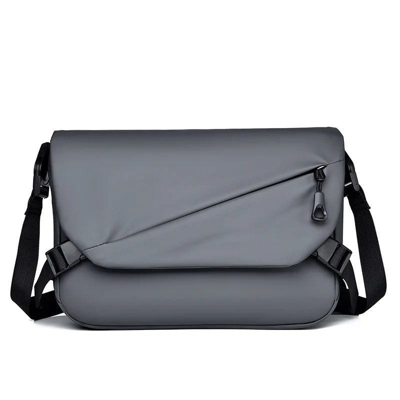 Borsa a tracolla grigia impermeabile, design moderno con tasca frontale con zip, ideale per laptop e uso quotidiano. Accessorio moda unisex.