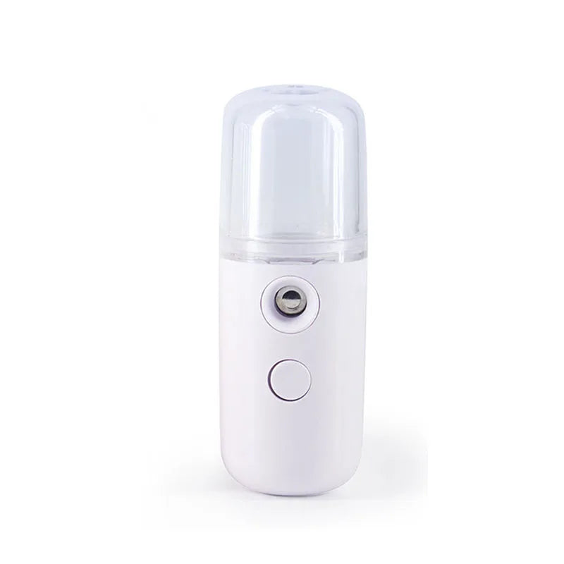 Umidificatore portatile bianco, nebulizzatore viso ricaricabile USB, design compatto, ideale per idratazione pelle e cura del viso.