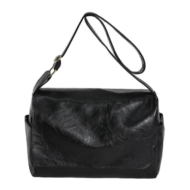 Borsa a tracolla in pelle nera, design elegante e moderno, ideale per donna. Accessorio moda versatile, perfetto per ogni occasione.