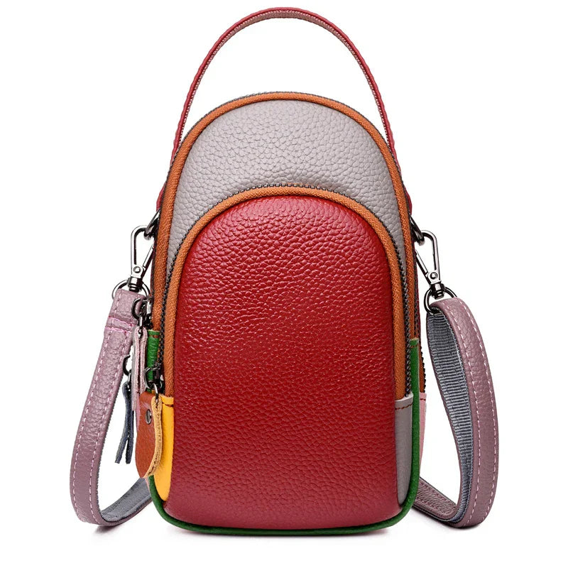 Borsa a tracolla in pelle multicolore, design compatto, chiusura con zip, manico superiore, ideale per moda donna, accessorio elegante e versatile.