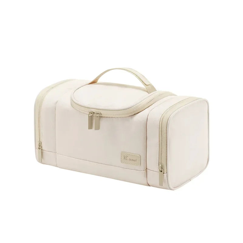 Borsa da viaggio beige con manico, design rettangolare, doppia cerniera. Ideale per organizzare accessori e cosmetici. Elegante e funzionale.