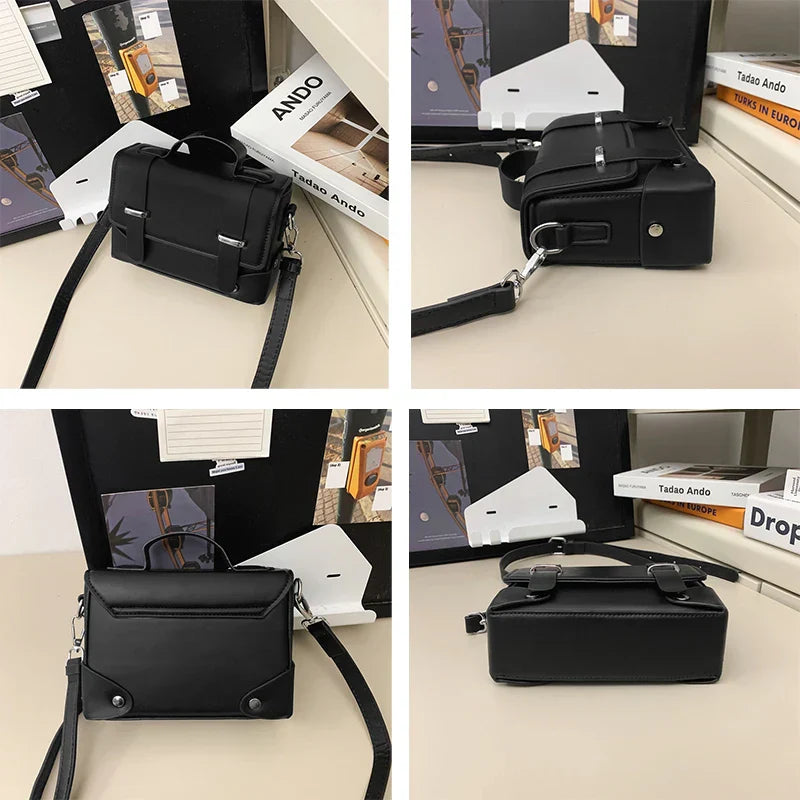 Borsa a tracolla nera in pelle, design moderno e minimalista, con dettagli metallici. Perfetta per moda urbana e look casual.