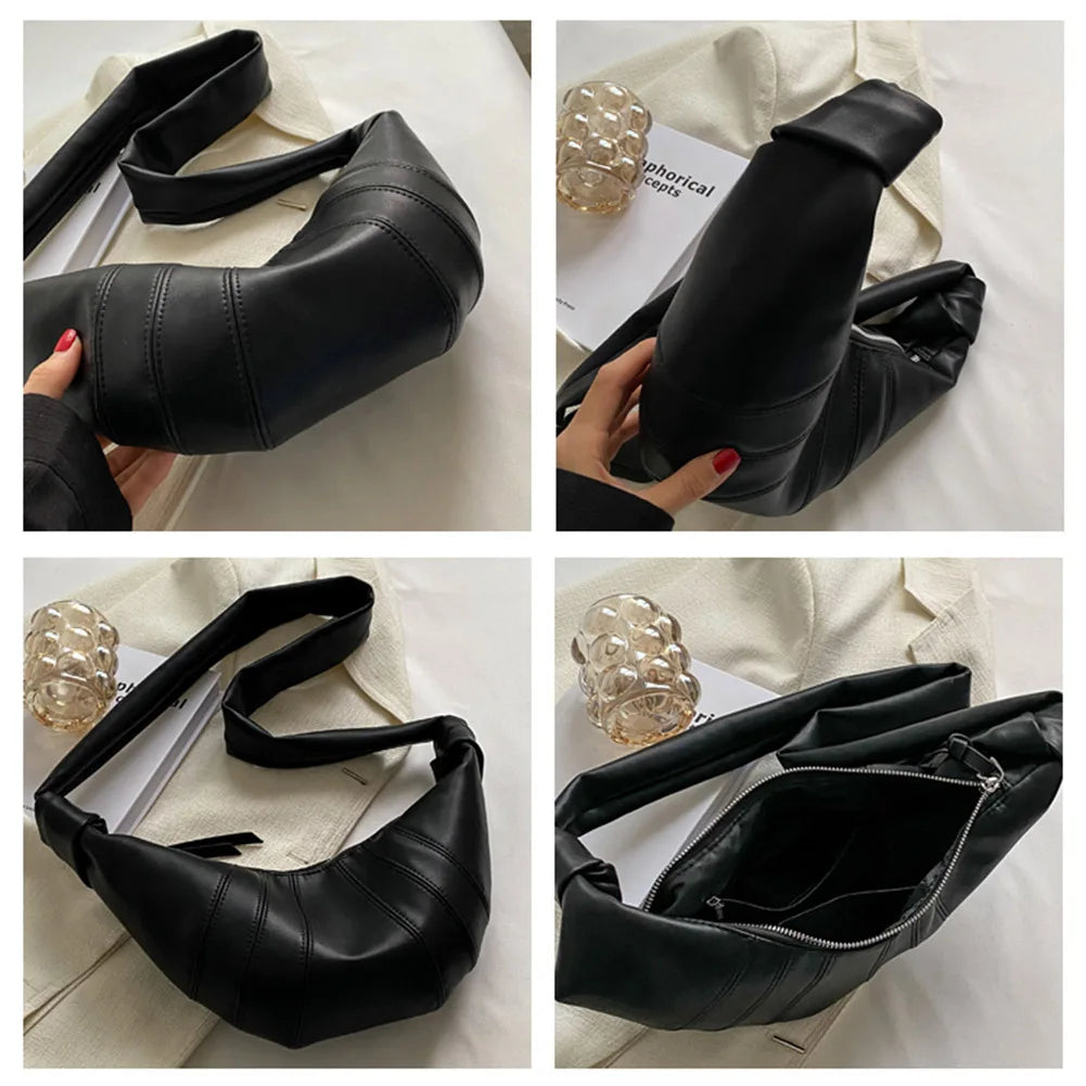 Borsa a tracolla nera in pelle, design moderno, chiusura con zip, dettagli cuciture, ideale per moda donna, accessorio elegante e versatile.