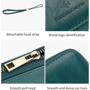 Portafoglio in pelle verde con cerniera dorata, logo "FOREVER MIYIN", cinturino staccabile, cuciture precise. Accessorio moda elegante e funzionale.
