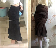 Gonna a tubino a vita alta, nera e marrone, con arricciature, indossata da modella. Moda femminile, abbigliamento elegante, stile autunnale.