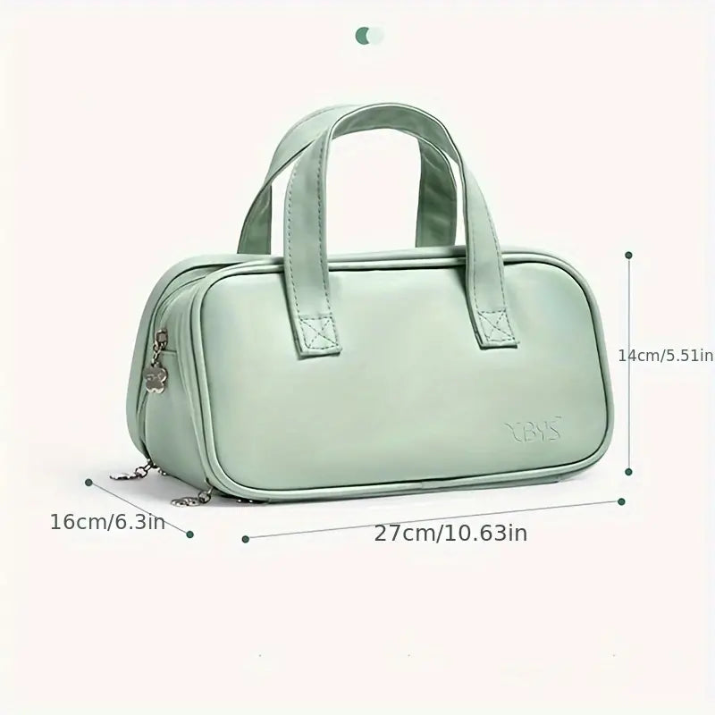 Borsa a mano verde menta in pelle sintetica, dimensioni 27x16x14 cm, con doppio manico e cerniera. Elegante e pratica per uso quotidiano.