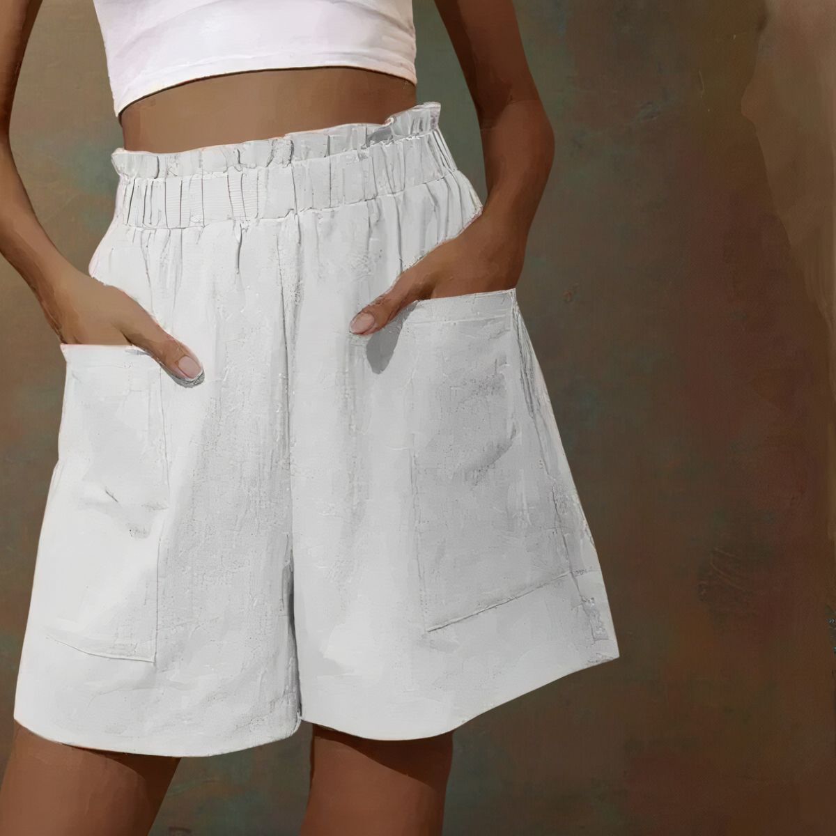 Shorts bianchi da donna con tasche grandi, vita alta elasticizzata, tessuto leggero. Ideali per moda estiva casual.