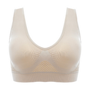 Reggiseno sportivo beige senza cuciture, design a rete traspirante, supporto confortevole, ideale per attività sportive e fitness.