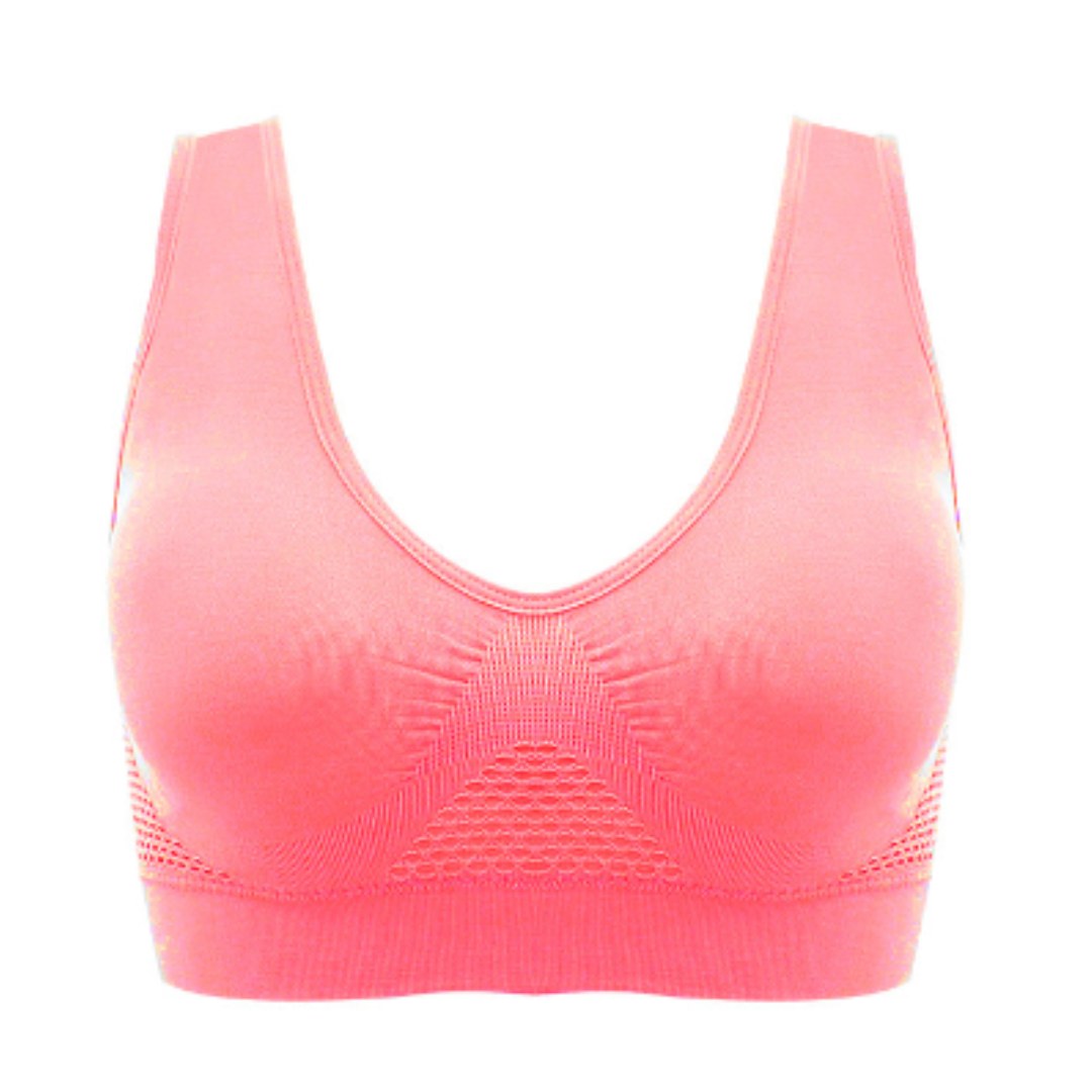 Reggiseno sportivo rosa senza cuciture, design a rete traspirante, supporto medio, ideale per fitness e yoga. Comfort e stile per allenamenti.