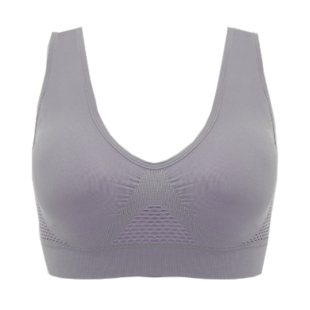 Reggiseno sportivo grigio senza cuciture, design a V, tessuto traspirante, supporto medio, ideale per fitness e yoga.