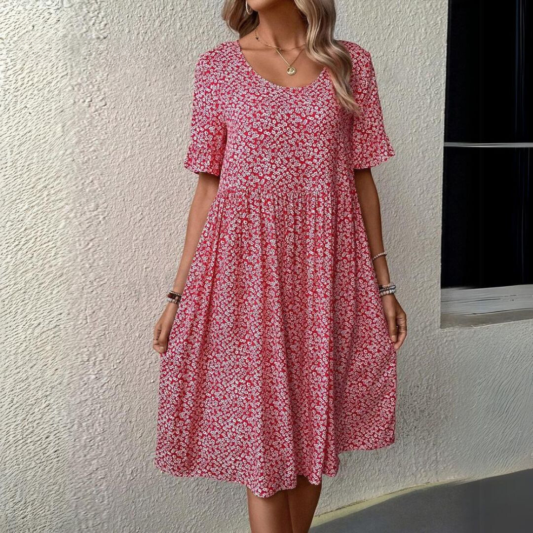 Abito estivo donna rosso a fiori, maniche corte, scollo rotondo, lunghezza al ginocchio. Elegante e casual, perfetto per giornate calde.