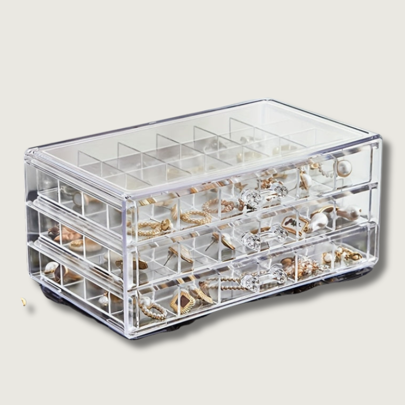 Organizzatore trasparente per gioielli con tre cassetti, ideale per conservare orecchini, anelli e collane. Design elegante e funzionale per la casa.