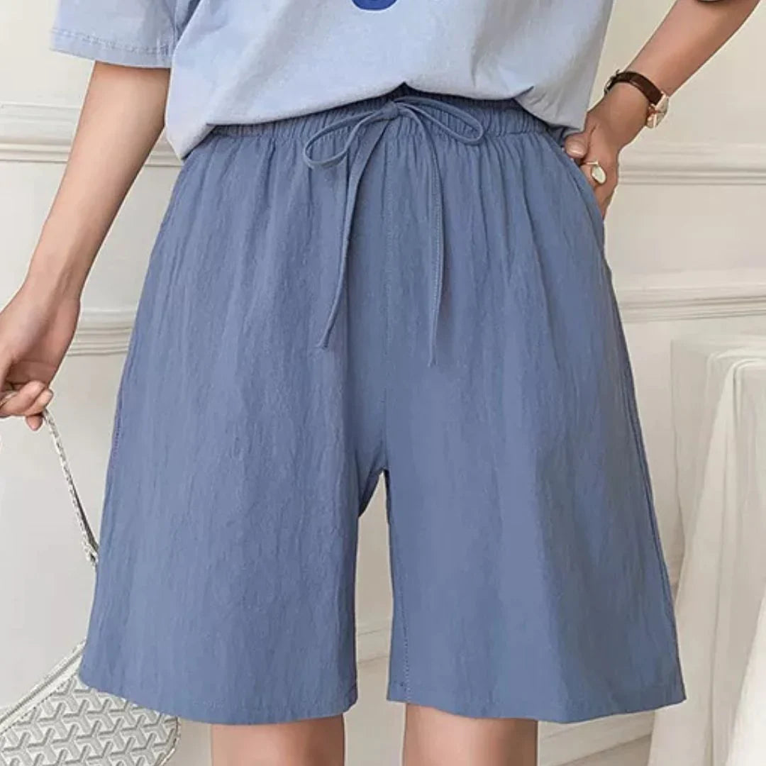 Pantaloncini donna blu, vita alta con laccio, tessuto leggero, stile casual estivo. Ideali per moda femminile, abbigliamento comodo.
