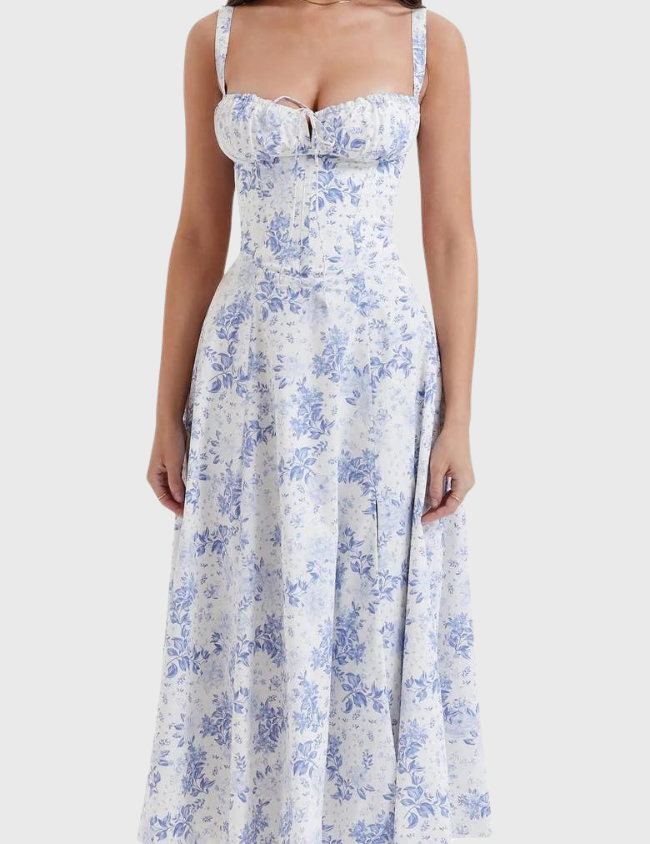 Abito estivo donna, lungo, floreale blu e bianco, senza maniche, scollo a cuore, perfetto per occasioni casual e eleganti.