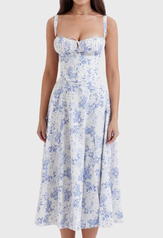 Abito estivo donna, lungo, floreale blu e bianco, senza maniche, scollo a cuore, perfetto per occasioni casual e eleganti.