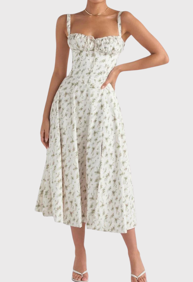Abito midi estivo bianco a fiori, spalline larghe, scollo a cuore, gonna svasata, perfetto per occasioni eleganti e casual.