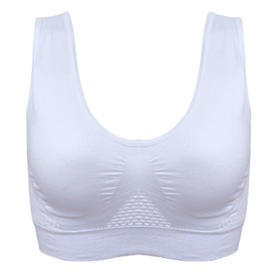 Reggiseno sportivo bianco senza cuciture, design a compressione, supporto medio, tessuto traspirante, ideale per fitness e yoga.