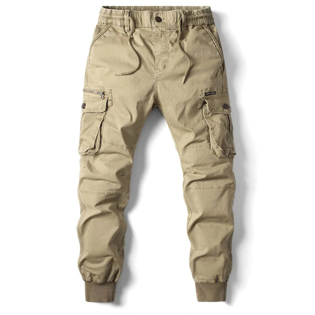 Pantaloni cargo beige da uomo, tasche multiple, elastico in vita e caviglie, stile casual, tessuto resistente, moda outdoor.