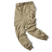 Pantaloni cargo uomo beige, tasche multiple, elastico in vita e caviglie, stile casual, tessuto resistente, moda outdoor, abbigliamento versatile.