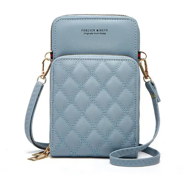 Borsa a tracolla in pelle trapuntata blu, design compatto con tasca frontale, chiusura a zip, ideale per smartphone. Accessorio moda elegante.
