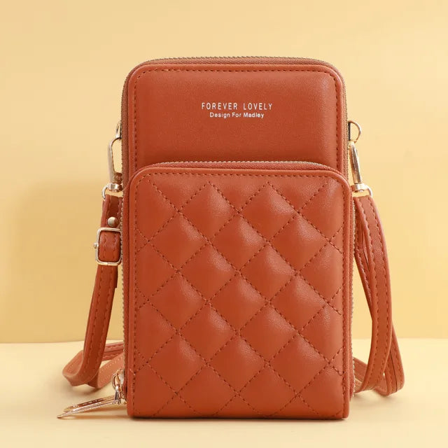 Borsa a tracolla in pelle marrone con design trapuntato, doppia tasca, chiusura con cerniera, ideale per smartphone e accessori. Elegante e pratica.