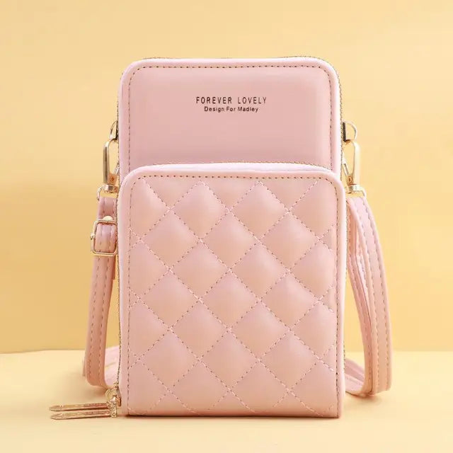 Borsa a tracolla rosa trapuntata in pelle sintetica, design compatto con cerniera, ideale per moda femminile e accessori eleganti.
