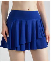 Gonna da tennis con pantaloncini integrati e tasche